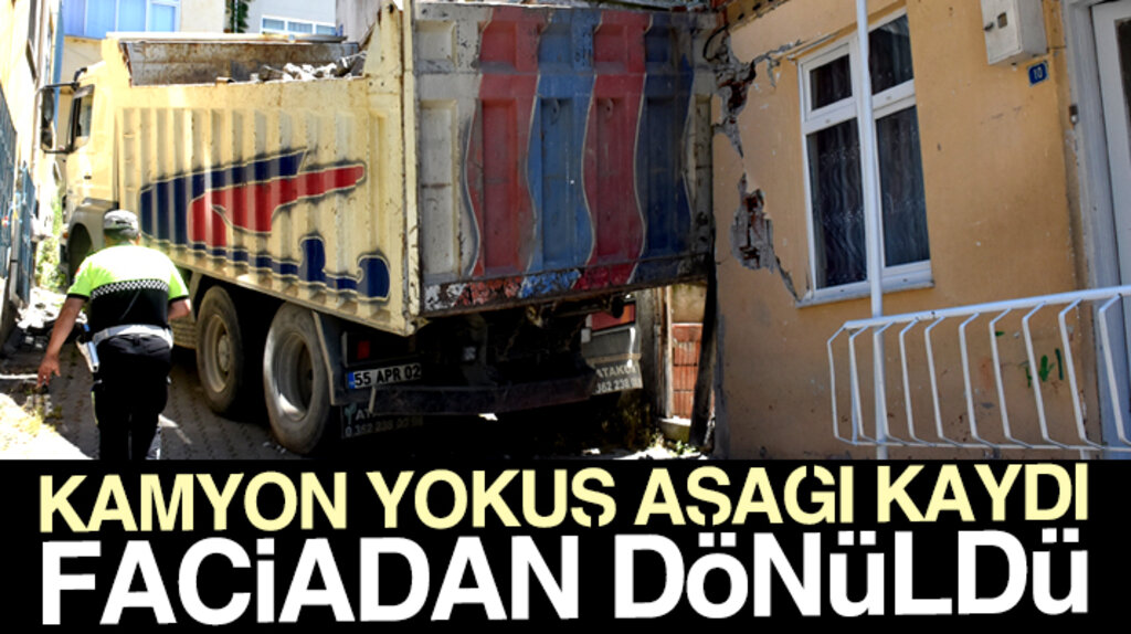Samsun'un Canik ilçesinde yokuş aşağı kayan kamyon iki katlı eve çarparak durdu